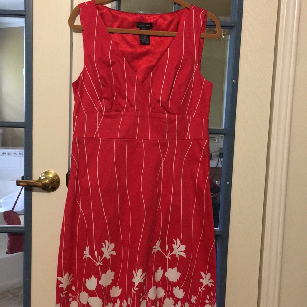 Dress dark pink with white pin stripes.